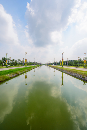 Nakhonpathom , Thailand - 5 Oct, 2018: Beautiful Utthayan Road with canal in centerのeditorial素材