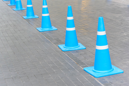 Blue traffic funnel row for sort the car traffic in streetの写真素材