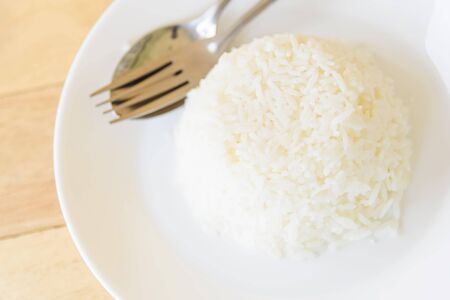cooked rice on white dishの写真素材