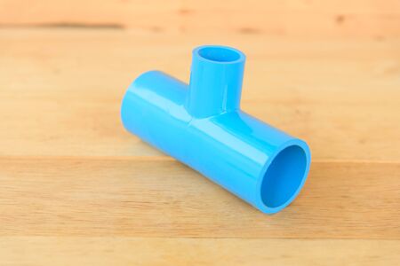 PVC Three way pipe on wood plateの写真素材