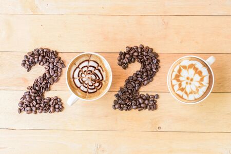 Hot cappuccino with coffee bean in 2020 year sign / Happy New year 2020の写真素材