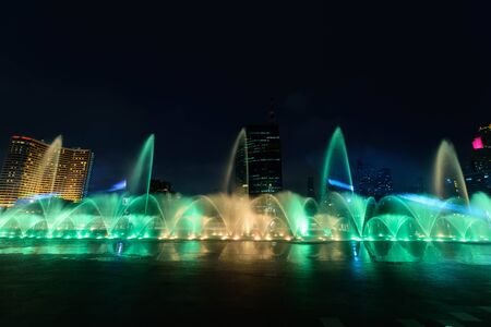 the fountain showing with lighting in night timeの写真素材