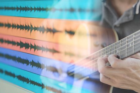 playing guitar for sound recording programの写真素材