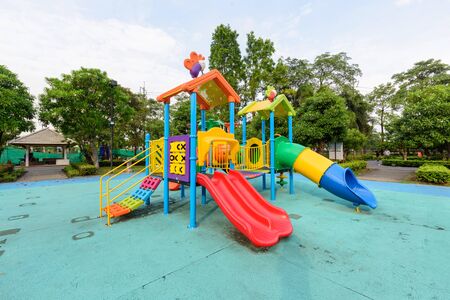 Big playground in public park and unidentified children playing it.の写真素材