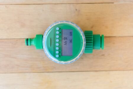 irrigation timer on wood plateの写真素材