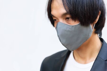 Asian man wear cloth mask for protect from covid-19 / cloth maskの写真素材