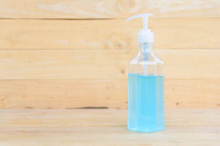 sanitizer gel for cleaning the hand on wood plateの写真素材