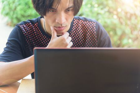 The man Think about working with laptopの写真素材