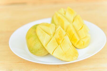 Ripe mango in the white dishの写真素材