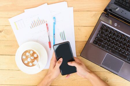 Work from home with hot coffee on the table / hot coffee with laptop on work spaceの写真素材