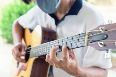 playing guitar in the parkの写真素材