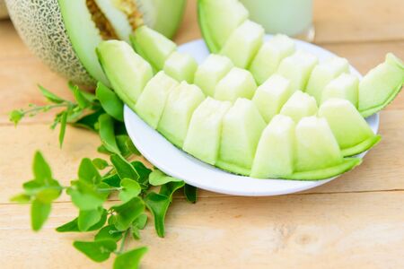 Fresh Green melon on dishの写真素材
