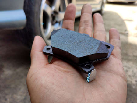 close up to brake pad of the car in handの写真素材