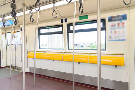 empty seat and pole in sky trainの写真素材