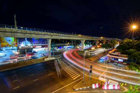Bangkok , Thailand -  2 August, 2020 :High view of blur light traffic at the road front side The mall shopping centerのeditorial素材
