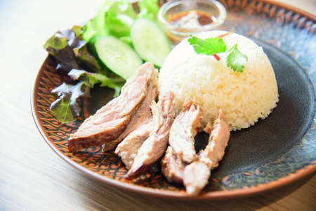 Roast pork with spicy souce rice on tableの写真素材