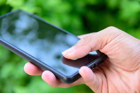 Fingerprint scanner on mobile screen / direct Fingerprint scanner on screen of smart phoneの写真素材