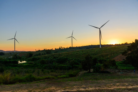 wind turbines park for make the electric power from wind in sunset timeの写真素材