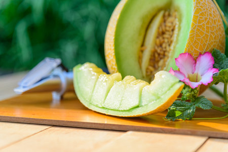 Fresh green melon on wood plateの写真素材