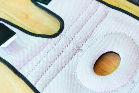 The man wear the Knee Support Brace Patella with sunlight in the park / Knee Pads Hole Sportsの写真素材