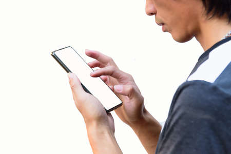 the man touch the screen for use social media on smartphoneの写真素材