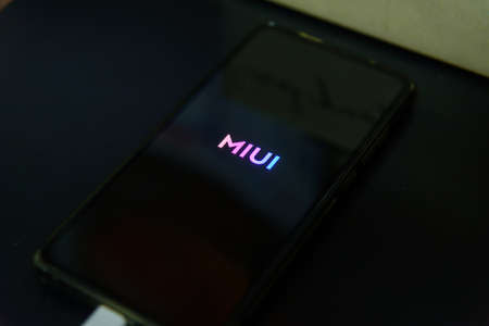 Rachaburi,Thailand - 21 February, 2021: Closeup focus to Smartphone model Mi9T updating MIUI android version 12 and Logo in reboot stepのeditorial素材