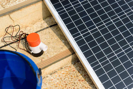 Testing bilge pump connected to use power from solar cell panelの写真素材