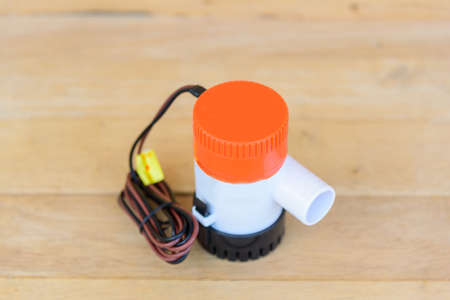 New bilge pump on wood plateの写真素材