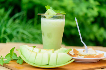 Milk melon Smoothie in glass with Roast breadの写真素材
