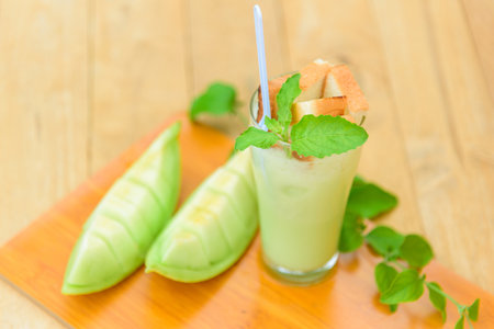 Milk melon Smoothie in glass with Roast breadの写真素材