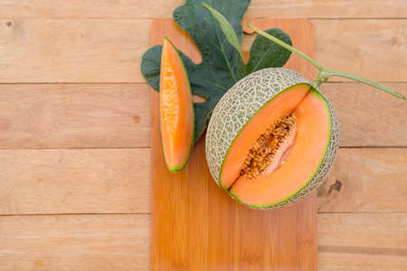 a lot of piece of fresh orange melon on the plateの写真素材