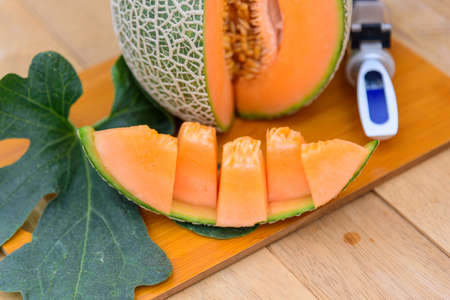 fresh orange melon on the plateの写真素材