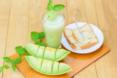 Milk melon Smoothie in glass with Roast breadの写真素材