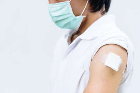 asian man wear mask and get vaccinatedの写真素材