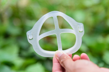 Inner Support Bracket Mask Bracket  with alcohol bottle on tableの写真素材