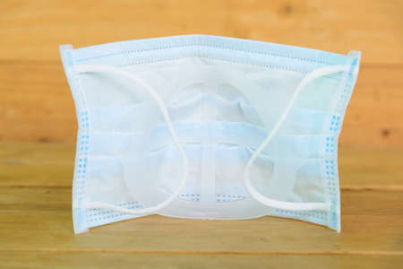 Inner Support Bracket Mask Bracket  with alcohol bottle on tableの写真素材