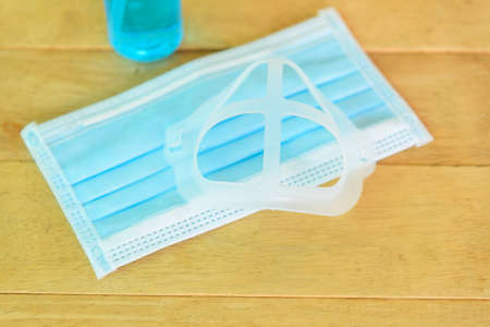 Inner Support Bracket Mask Bracket  with alcohol bottle on tableの写真素材