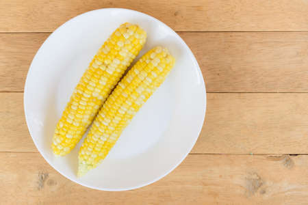 Closeup to white boiled cornの写真素材