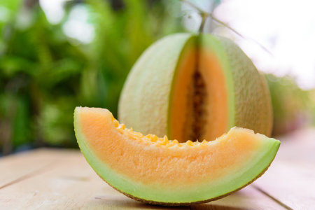 a lot of piece of fresh orange melon on the plateの写真素材