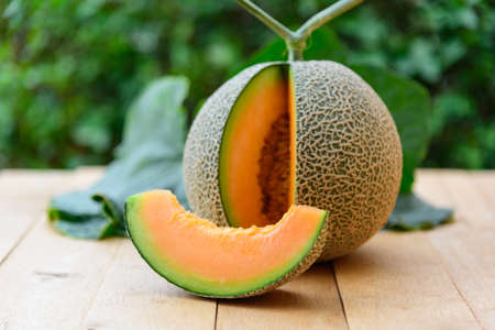 a lot of piece of fresh orange melon on the plateの写真素材