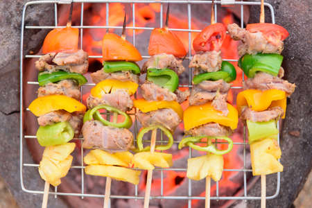 Grill the pork barbecue with fire on the stoveの写真素材