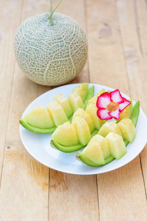 a piece of fresh green melon in dishの写真素材
