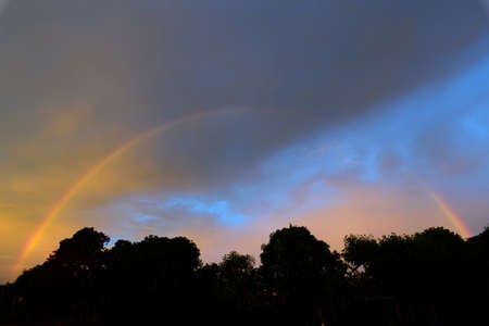 rainbow on the sky after raining time eveningの写真素材