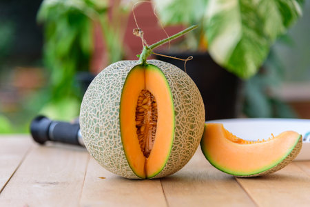 Fresh Orange melon on the wood plateの写真素材