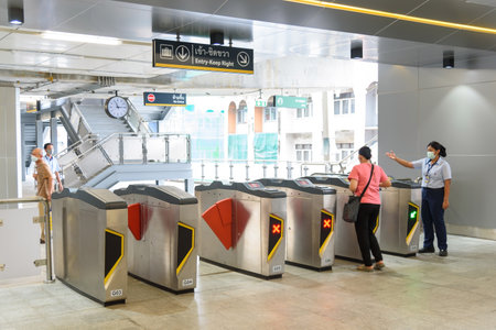 Bangkok,Thailand - 6June, 2023:  People enter the door gate for passenger  Thai electric monorail train yellow lineのeditorial素材