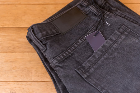 New jeans with label on wood plateの写真素材