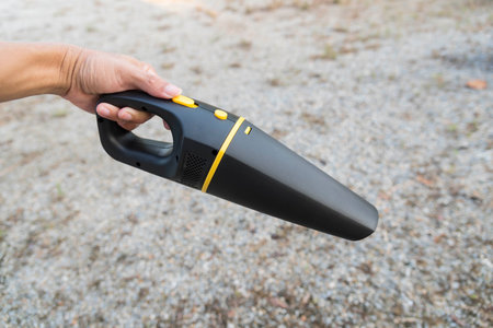 car vacuum cleaner in the hand