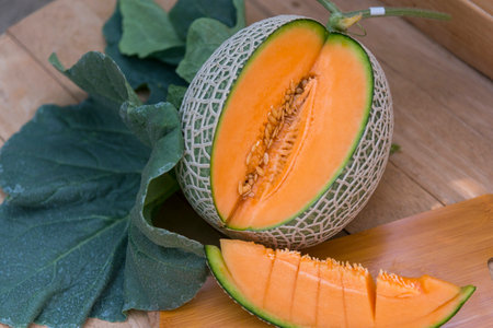 a lot of piece of fresh melon on the plateの写真素材