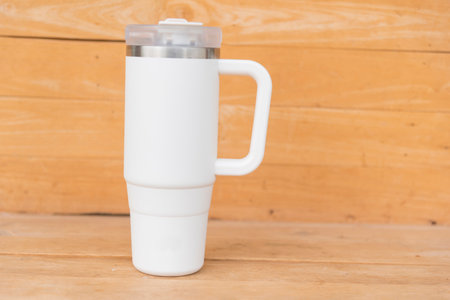 White HANDLE TUMBLER on wood tableの写真素材