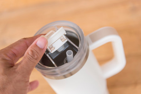 White HANDLE TUMBLER on wood tableの写真素材